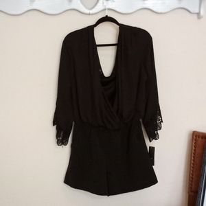 Black BCX short romper. Size L